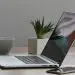 Free Minimalist home office desk with laptop, smartphone, and plant for a modern work environment. Stock Photo